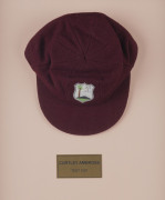 CURTLY AMBROSE'S WEST INDIES TEST TEAM CAP, maroon wool with the West Indies logo embroidered to front. Cap by Bill Edwards of Swansea with Ambrose's name in pen on the label (partly overwritten). Attractively framed. [Ambrose played in 98 Tests for the W