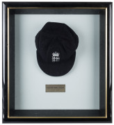 DEVON MALCOLM'S ENGLAND HOME TEST TEAM CAP, navy blue wool with embroidered Crown over three lions on front, with "D.M." to inside label. Very fine condition. Attractively framed. - 2