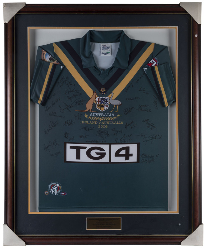 INAUGURAL AUSTRALIAN WOMEN'S INTERNATIONAL RULES TOUR official player's jersey "AUSTRALIA v IRELAND 2006" signed in full by the complete Australian Touring Party who played in two matches in Ireland. Attractively framed & glazed; overall 111 x 90cm.