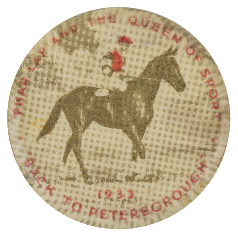 PHAR LAP: Souvenir pin badge depicting the famous horse "PHAR LAP AND THE QUEEN OF SPORT - 1933 BACK TO PETERBOROUGH".