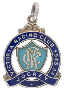 1933-34 VICTORIAN RACING CLUB JOCKEY's Membership badge in sterling silver and blue enamel; made by Stokes.