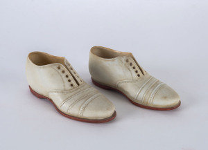 A pair of miniature ceramic cricket shoes, circa 1900; no maker's mark, but both stamped on the heel "Rd No:335843" (2).