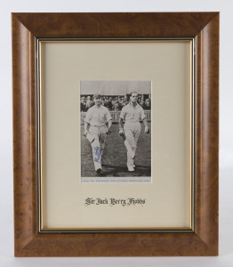 JACK HOBBS, pen signature on a photgraph of him walking out to bat with Herbert Sutcliffe at Birmingham in 1924. Framed & glazed; overall 35 x 29cm.