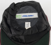 CURTLY AMBROSE'S WEST INDIES TEST TEAM CAP, maroon wool with the West Indies logo embroidered to front. Cap by Bill Edwards of Swansea with Ambrose's name in pen on the label (partly overwritten). Attractively framed. [Ambrose played in 98 Tests for the W - 4