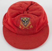 JEFF HAMMOND'S SOUTH AUSTRALIA CRICKET CAP, baggy red with embroidered badge on front, endorsed inside "Ham". Attractively framed. [Hammond played in 5 Tests 1972-73, and played for South Australia between 1969 and 1981]. Provenance: Leski Auctions, Augus - 3