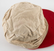 JEFF HAMMOND'S SOUTH AUSTRALIA CRICKET CAP, baggy red with embroidered badge on front, endorsed inside "Ham". Attractively framed. [Hammond played in 5 Tests 1972-73, and played for South Australia between 1969 and 1981]. Provenance: Leski Auctions, Augus - 4