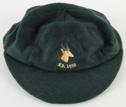 DUDLEY NOURSE’S SOUTH AFRICA 1935 TEST TEAM CAP, green wool, embroidered springbok & 'S.A.1935' on front, made by Devereux of Eton, and named to NOURSE in pen on the label. Good match-worn condition. Attractively framed. - 3