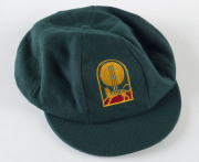 DAVID BOON'S TASMANIAN CRICKET CAPBaggy Green, with embroidered Tasmanian Tigers logo to front (cricket ball and stumps over a Tasmanian Tiger), signed inside by David Boon. Attractively framed. [David Boon played 107 Tests 1984-96, and represented Tasman - 3