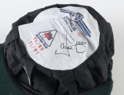 DAVID BOON'S TASMANIAN CRICKET CAPBaggy Green, with embroidered Tasmanian Tigers logo to front (cricket ball and stumps over a Tasmanian Tiger), signed inside by David Boon. Attractively framed. [David Boon played 107 Tests 1984-96, and represented Tasman - 4