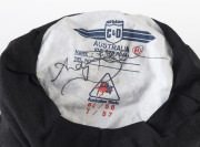ANDY BICHEL'S QUEENSLAND CRICKET CAP, baggy maroon with embroidered "QUEENSLAND BULLS" badge on front, signed inside by Andy Bichel. [Bichel, a right-arm medium-fast bowler, played 19 Tests 1997-2003 and represented Queensland 98 times between 1992 and 20 - 4