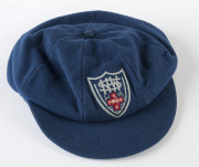 JOHN GLEESON'S NEW SOUTH WALES STATE TEAM CAP blue wool, embroidered 'NSWCA' shield logo on front. Attractively framed. [Gleeson played in 29 Tests for Australia between 1967 and 1972; he was first selected for the NSW Team in 1966. He was best known for - 3