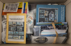 COMMONWEALTH OF AUSTRALIA: General & Miscellaneous: Territories accumulation including PNG 1989 year book, stamp packs predominantly duplicated AAT, plus a few Xmas & Cocos, stamps in packets including a few Pitcairns & Samoa, AAT face value. Worth exploring.