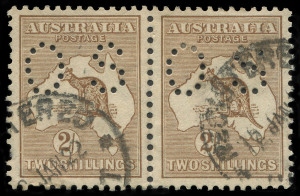 COMMONWEALTH OF AUSTRALIA: Kangaroos - Second Watermark: 2/- Light Brown perforated 'OS' pair, one pulled perf, well centred, HOBART REGISTERED '12JAN22' datestamp (late usage), BW:36ba - $800+. Scarce multiple.