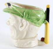 DON BRADMAN toby jug, with cap in green, made by Marutomo Ware, 1934, 15cm high. - 2