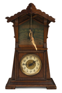 JUNGHANS "Acrobat" novelty mantel clock in oak case with handpainted circus scene backdrop, 19th century, German movement in American oak case, 39cm high