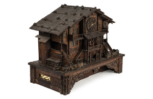 Swiss Musical Chalet clock containing a six tune cylinder music box, circa 1885, 47cm high, 60cm wide