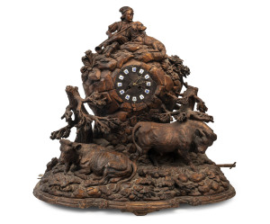 BLACK FOREST ornate musical clock in the form of a rocky outcrop with peasant boy, cows and dog, enamel cartouche Roman numerals, late 19th century, ​63cm high