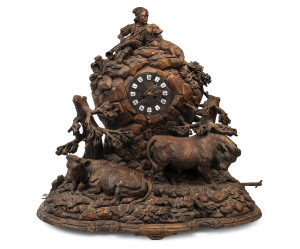 BLACK FOREST ornate musical clock in the form of a rocky outcrop with peasant boy, cows and dog, enamel cartouche Roman numerals, late 19th century, 63cm high