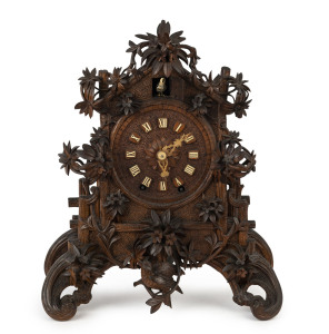 BLACK FOREST shelf model cuckoo clock with finely carved edelweiss floral case, circa 1865, 46cm high