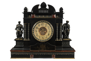 JOHN WREN Clock. An impressive French mantel clock with large visual escapement and bim-bam strike, adorned with bronze figures, black slate case engraved with a very unusual Australian coat of arms in landscape lower centre, also inlaid with rougue marble. This clock sat on the mantel in the dining room of John Wren's hotel in Collingwood and has often been remembered there by former patrons of the Yarrawonga Clock Museum. Weighing a staggering 12 stone in the old measure this is truly a statem