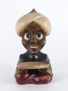 German Art Deco novelty clock of seated boy with revolving eyes, polychrome composite case, circa 1926, 19.5cm high
