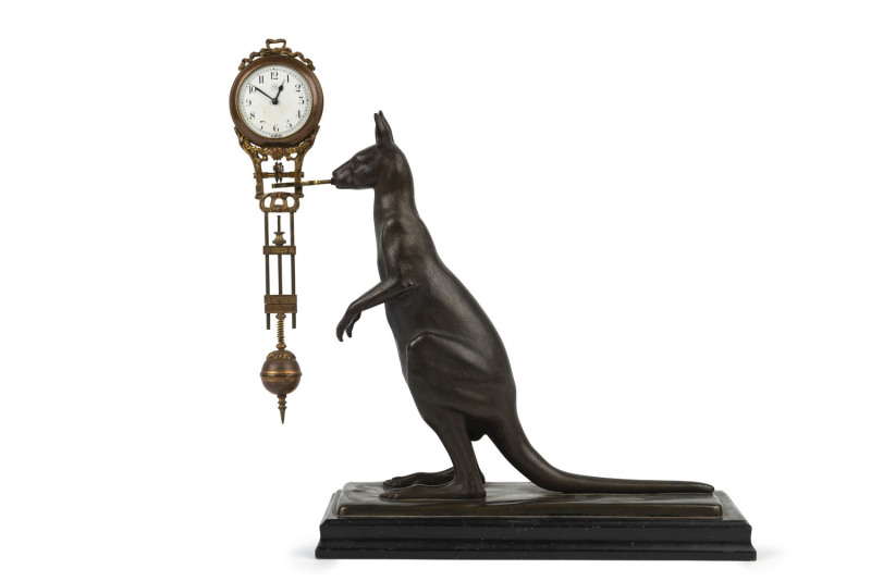 KANGAROO Mystery clock by Junghans, German, late 19th early 20th century, 8 day brass cased time piece supported on a bronze kangaroo figure mounted on timber base, 31cm high
