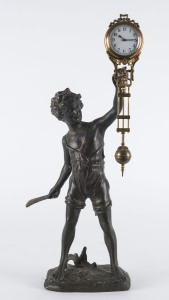 BAT BOY Mystery clock by Junghans, German, late 19th early 20th century, 8 day brass cased time piece supported on a bronze figure of a boy, 45cm high