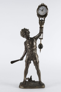 BAT BOY Mystery clock by Junghans, German, late 19th early 20th century, 8 day brass cased time piece supported on a bronze figure of a boy, 45cm high