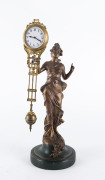 DIANA Mystery clock by Junghans, German, late 19th early 20th century, 8 day brass cased time piece, gilt metal statue on green finished plinth, 34cm high