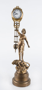 DIANA Mystery clock by Junghans, German, late 19th early 20th century, 8 day brass cased time piece, gilt finished metal statue standing on a lion, most likely later plinth and finish, 42cm high