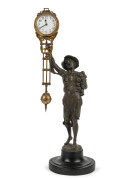 ONION BOY Mystery clock by Junghans, German, late 19th early 20th century, 8 day brass cased time piece, white metal statue standing on ebonized wooden base, 40cm high