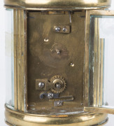 A French oval brass and glass cased carriage clock with Roman numerals, 19th century, 15cm high - 2
