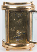 A French oval brass and glass cased carriage clock with Arabic numerals, 19th century, 15cm high - 2