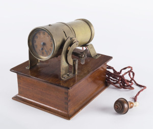 NIGHT PROJECTION Clock, designed by A. Loebel in 1909 and first appeared in a Gamages catalogue in 1913, 8 day movement with platform cylinder escapement, rare. 15.5cm across