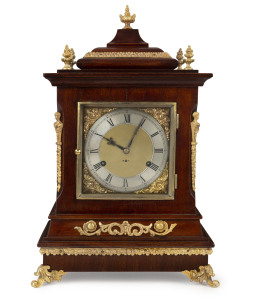 WILCOX Canadian bracket clock, strikes on 5 gongs, mahogany case with ormolu mounts adorned with five finials and silvered dial, circa 1888, movement signed "WILCOX, CANADA". Note: the pendulum mounts from under the clock case. 48cm high