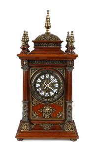 ANSONIA "Antique" mantel clock with enamel cartouche numerals, rosewood case with ornate gilt metal decoration and turned finials, circa 1894, 46cm high