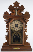 E. INGRAHAM CLOCK Co. "Pansy" 8 day time and strike alarm shelf clock with additional thermometer and spirit level, walnut case, original glass with inscription "Time Is Money", circa 1890, 61.5cm high