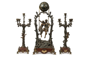 Rare and impressive French "Swinging Globe Timepiece" 3 piece clock set with couple on a swing, bronze finished cast metal on rouge marble bases, circa 1900. The couple pendulum swings side to side within the arch. With title plaque lower centre "Idylle Printanière, Par Geo. Maxime", 83cm high