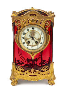 GILBERT "Orleans" rare Art Nouveau ruby glass timepiece with 8 day hour strike on cathedral gong with visual escapement, gilt metal mounts, with faux mercury pendulum, circa 1910, 27cm high