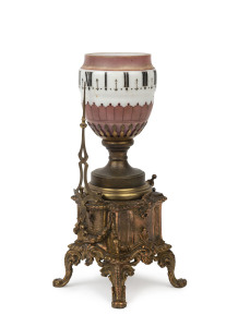 A French night light clock, gilt metal case with original rotating glass shade, 19th century, 27.5cm high