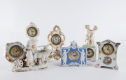Group of six assorted porcelain cased clocks, American, German and English, 19th and 20th century, ​the tallest 25cm high