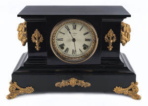 ANSONIA "Brandon", 8 day hour and half hour time and strike shelf clock with black metal case adorned with gilt metal bison heads, scarce model, circa 1904, 27cm high