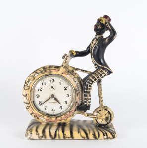 WESTCLOX novelty clock with black minstrel on bicycle, painted plaster case, early to mid 20th century, 30cm high