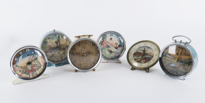 Six novelty alarm clocks in blue, cream and white enamel cases, 20th century, tallest 12cm high