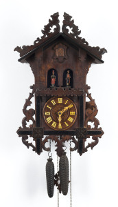 BLACK FOREST "Weather House" hanging cuckoo clock with carved figures controlled by internal barometer, one with umbrella, circa 1860, 54cm high