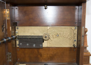 POLYPHON Musical clock in architectural timber case, with 6 discs, circa 1900, ​Junghans movement with Regina player. 56cm high - 4