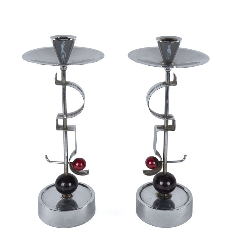 A pair of German Art Deco chrome and bakelite candlesticks designed by Fritz August Breuhaus de Groot for W.M.F. circa 1930, stamped "WCROM, WMF", 33cm high