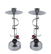 A pair of German Art Deco chrome and bakelite candlesticks designed by Fritz August Breuhaus de Groot for W.M.F. circa 1930, stamped "WCROM, WMF", 33cm high