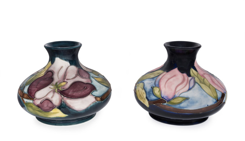 Two MOORCROFT "Magnolia" pattern squat baluster shaped pottery vases, circa 1980/90s, 10.5cm high