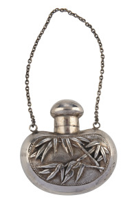 A Chinese silver kidney shaped scent bottle with embossed floral cartouche, Shanghai, circa 1900, 4.5cm high